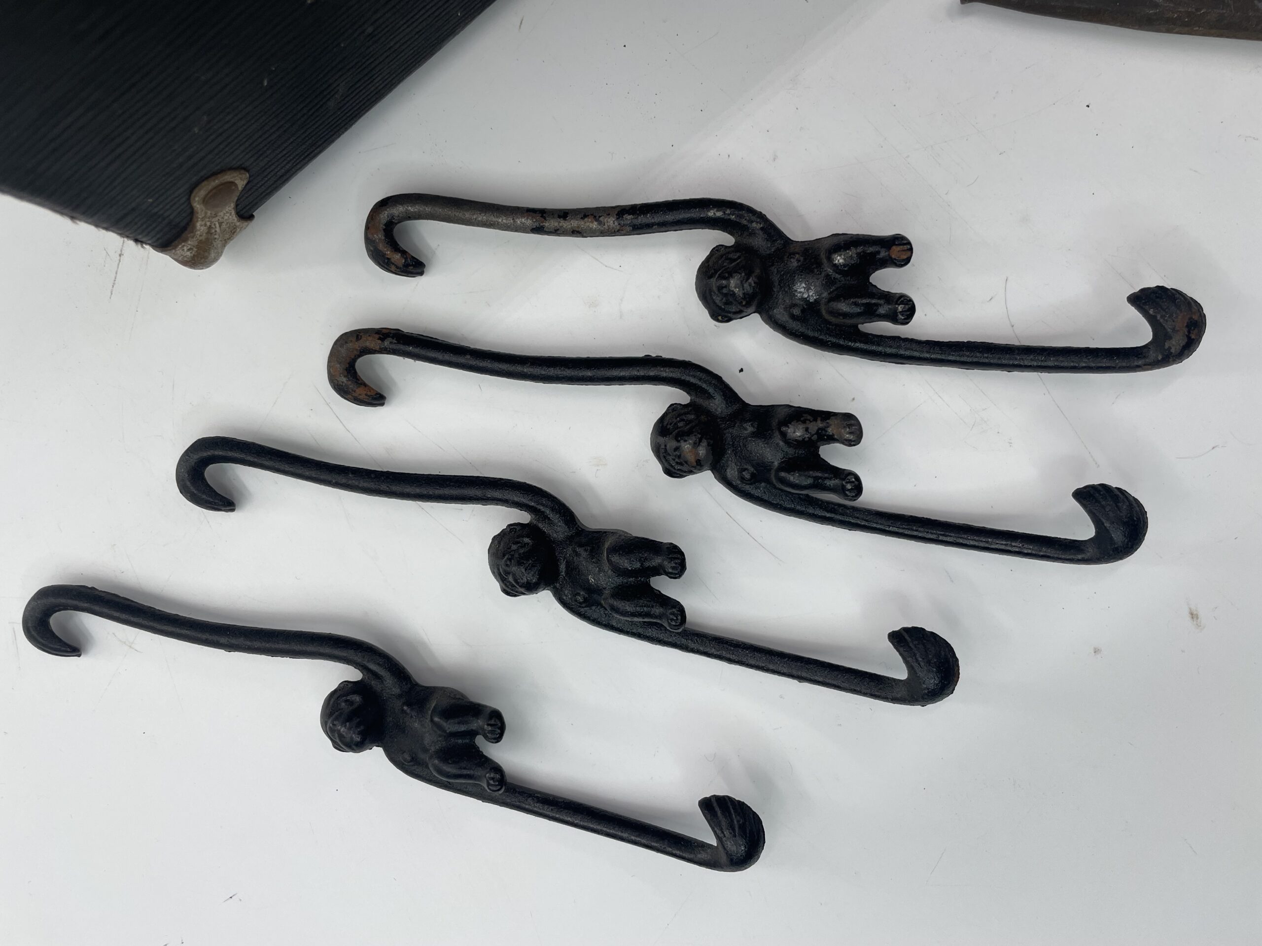 Lot # 83 – Antique Doctors contraption box, cast iron hanging monkey hooks, small grinder & more! - Image 2