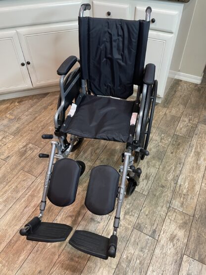 Lot # 75 – Wheelchair w/ leg supports.