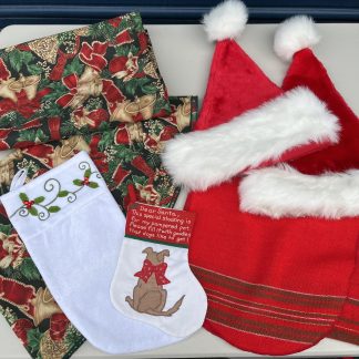 Lot #234 - Christmas: 60" Round Table Cloth / 2 Santa Hats / 2 Stockings / 82" x 60" Rectangular Tablecloth / 4' Table Runner
