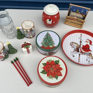 Lot #236 - Christmas Mugs / Clear Glass Snowman Jar / 2 Christmas Tins / Santa Metal Tray / Snowman Cookie Jar / 3 Red Glass Stir Sticks with Christmas Tree Tops / Christmas Napkin and Coaster Holder