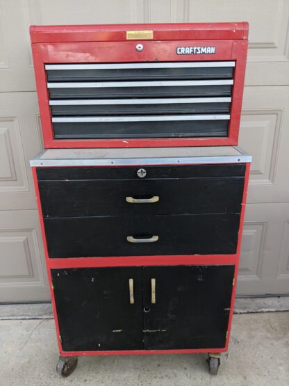 Lot # 20 – Red rolling tool chest / cabinet combo w/ a large assortment of tools.