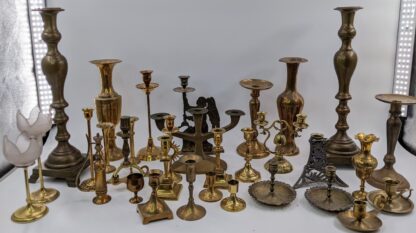 Lot # 45 – Large assortment of heavy brass & bronze candlestick holders