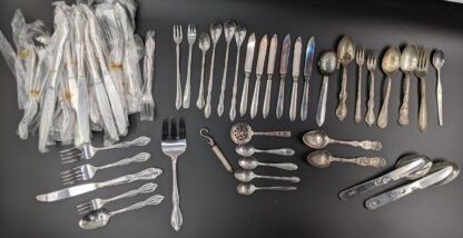 Lot # 56 – New (old stock) silverware, Boy Scout’s Camping Flatware Combo, other assorted vintage silverware.