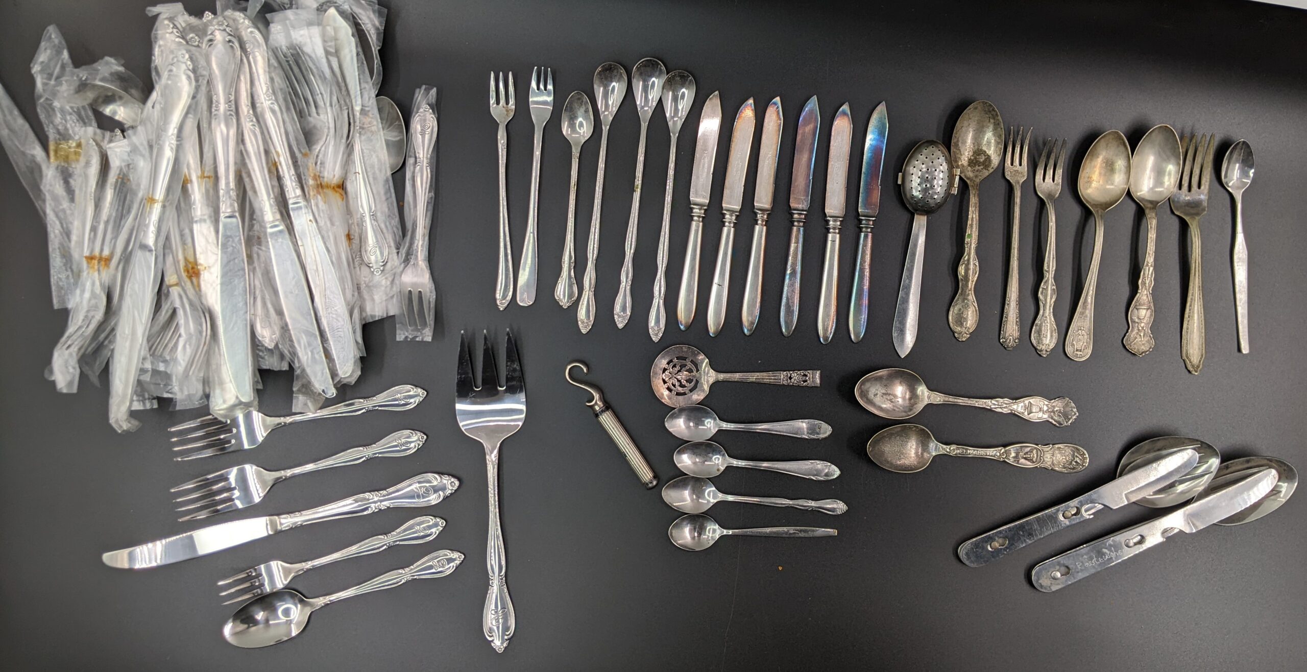 Lot # 56 – New (old stock) silverware, Boy Scout’s Camping Flatware Combo, other assorted vintage silverware.
