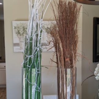 Lot # 158 - Two Very Tall Glass Vases W/ Faux Grass and Reed Filling